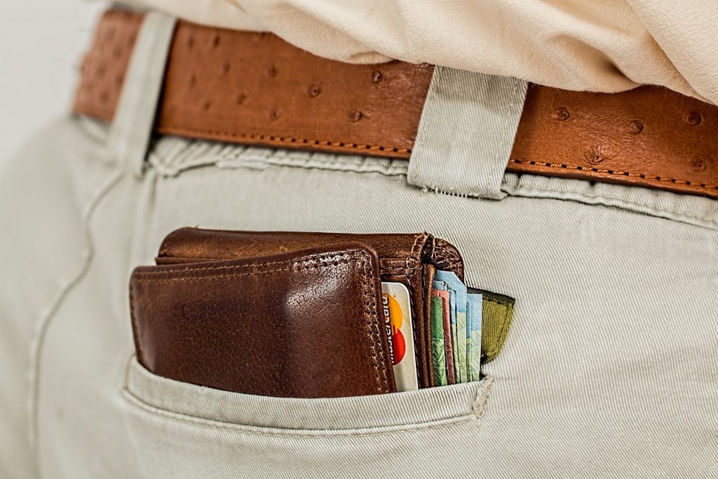 detail of a pocket with a wallet with debit cards unsafe