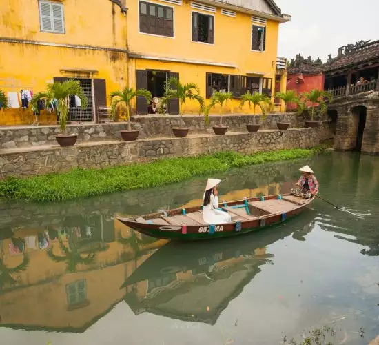 boat in a canal in hoi an