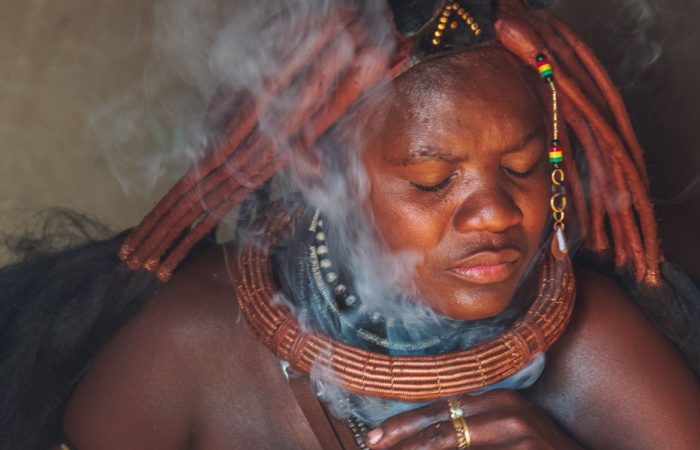 Himba woman doing a ritual